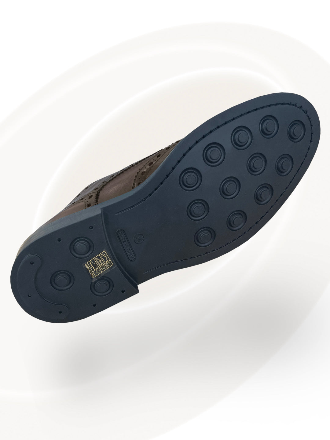 Black sole of a shoe with a brand logo on a white background