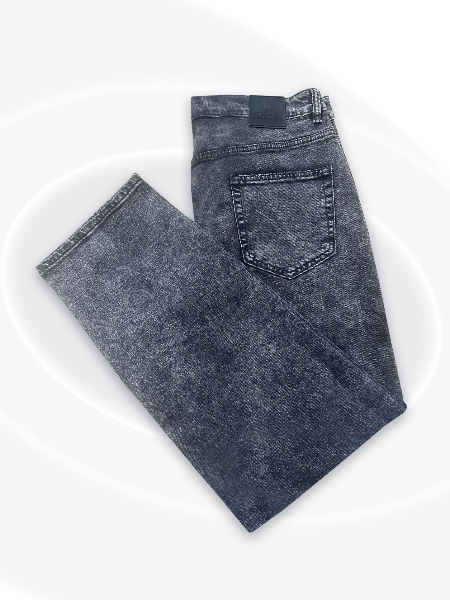A pair of folded dark gray acid-wash jeans displayed on a clean white background.