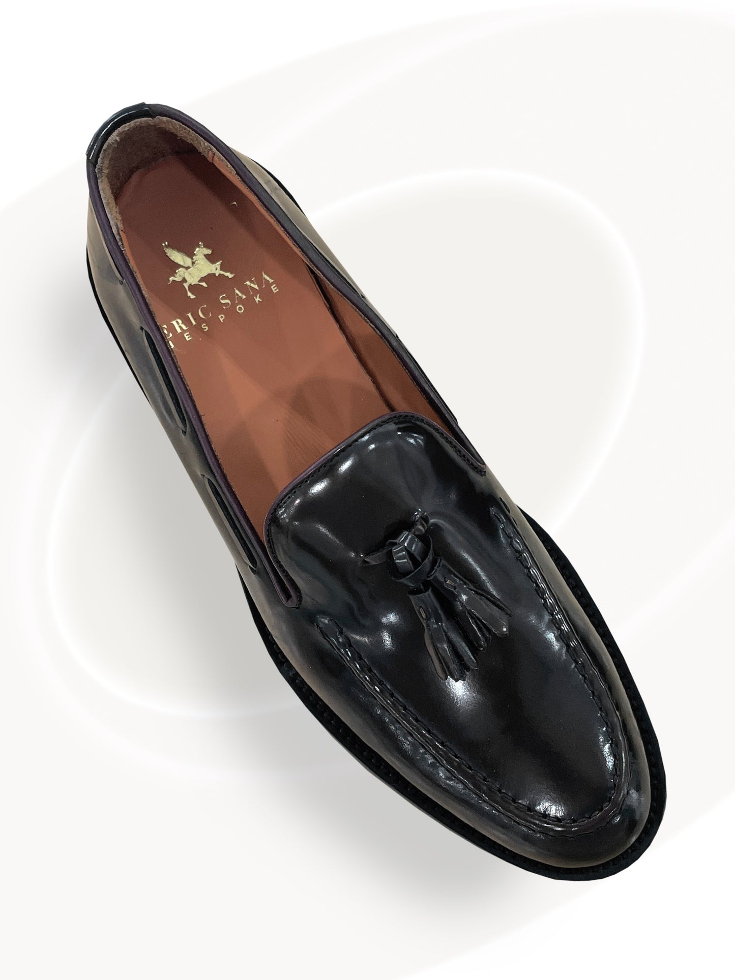 Black loafer shoe on a white background