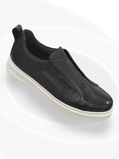 Black slip-on sneaker on a white background