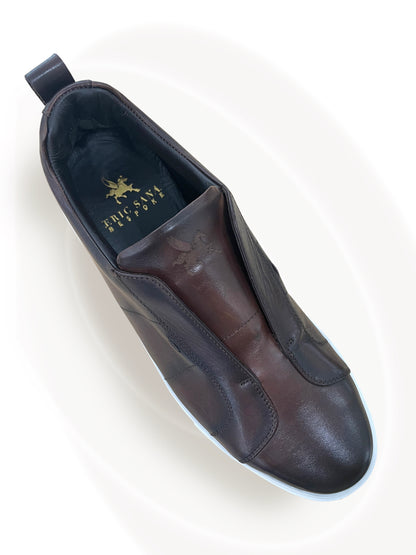 Black leather shoe on a white background