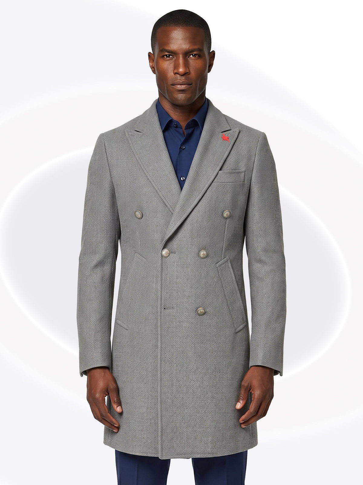 Man wearing a gray overcoat with a white background