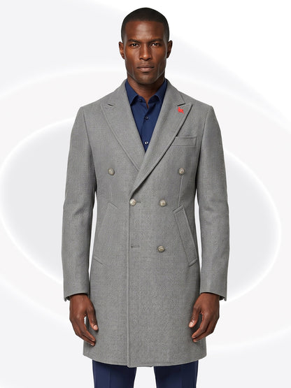 Man wearing a gray overcoat with a white background