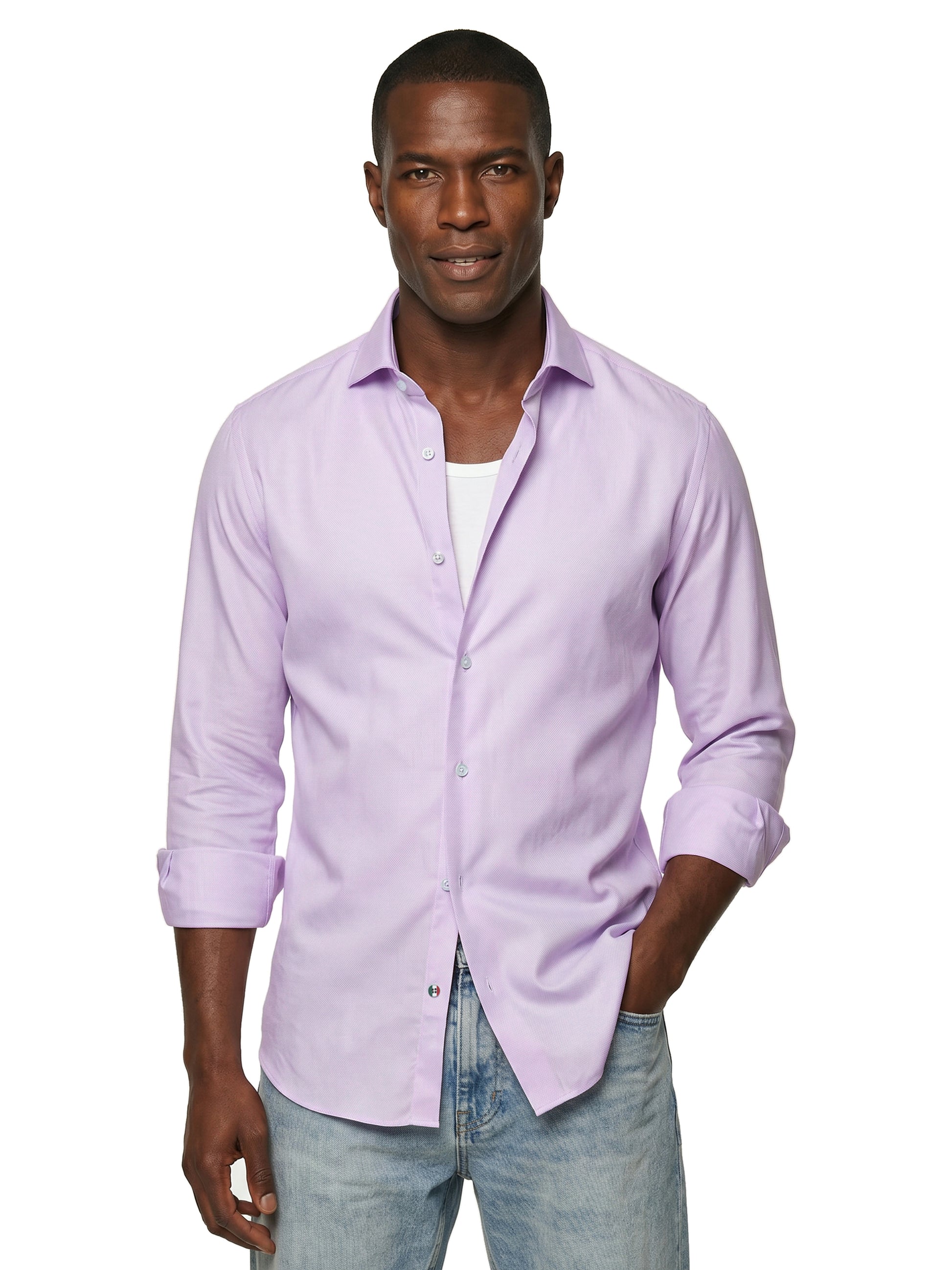 Man wearing a light pink button-up shirt and jeans on a white background