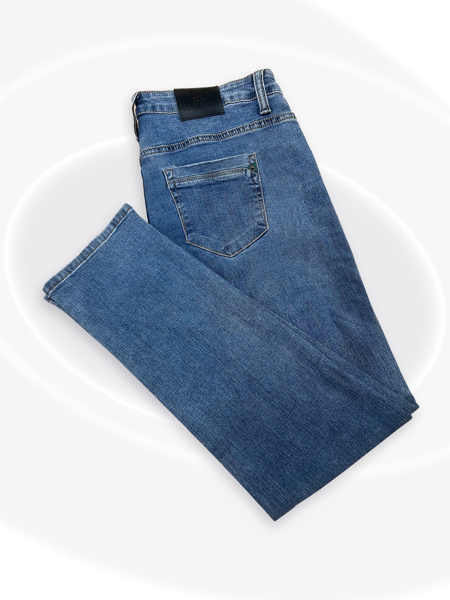 A pair of folded blue denim jeans with a classic five-pocket design, shown on a clean white background with subtle concentric circle graphics.