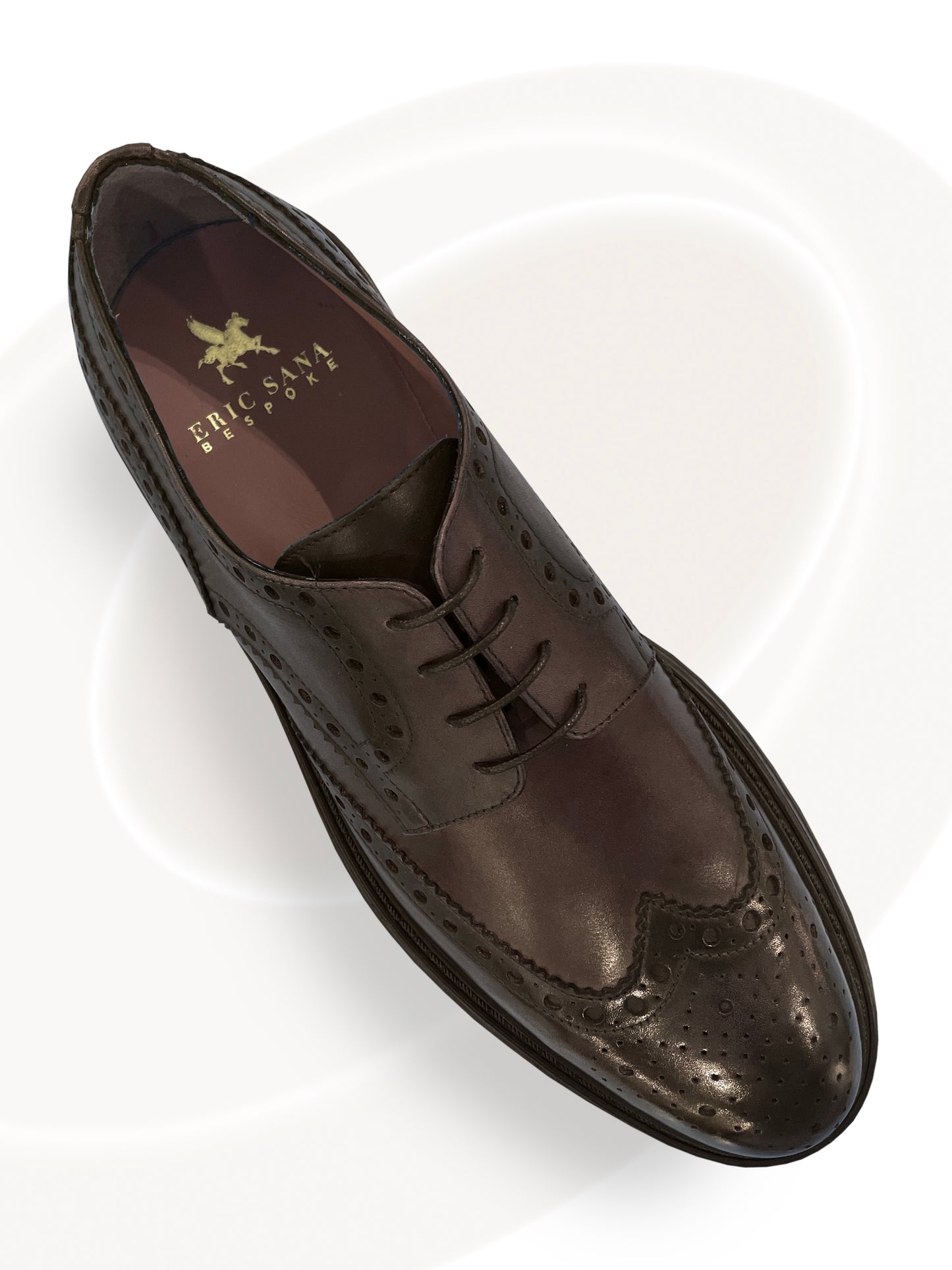 Brown leather dress shoe with brand logo on a white background