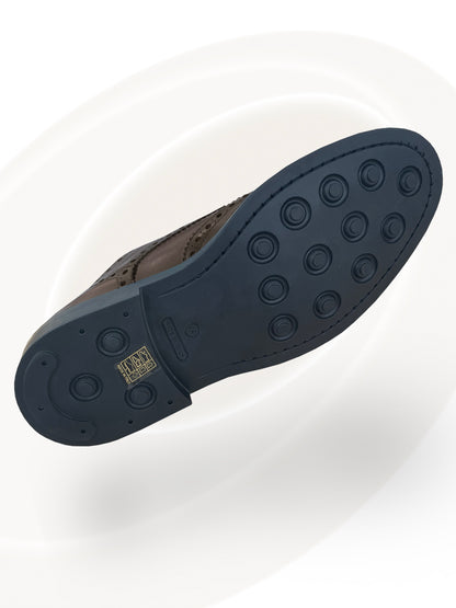 Black sole of a shoe with a brand logo on a white background