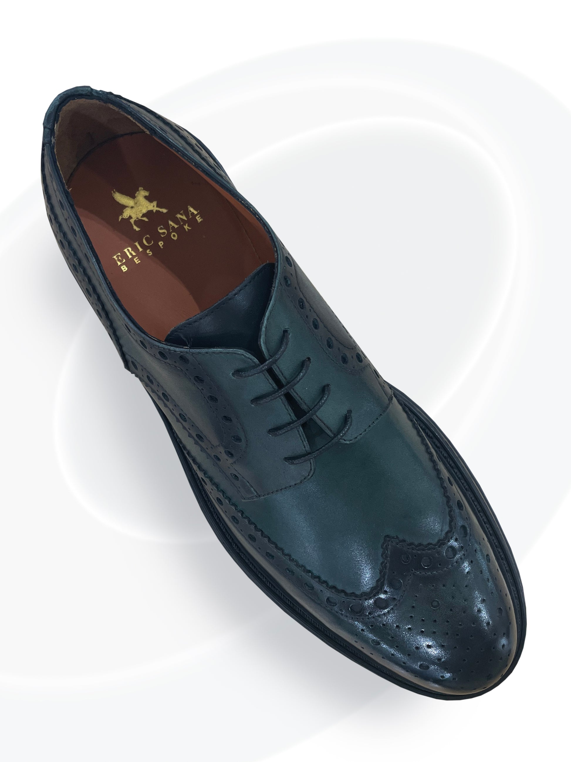 Brown leather dress shoe with brand logo on a white background
