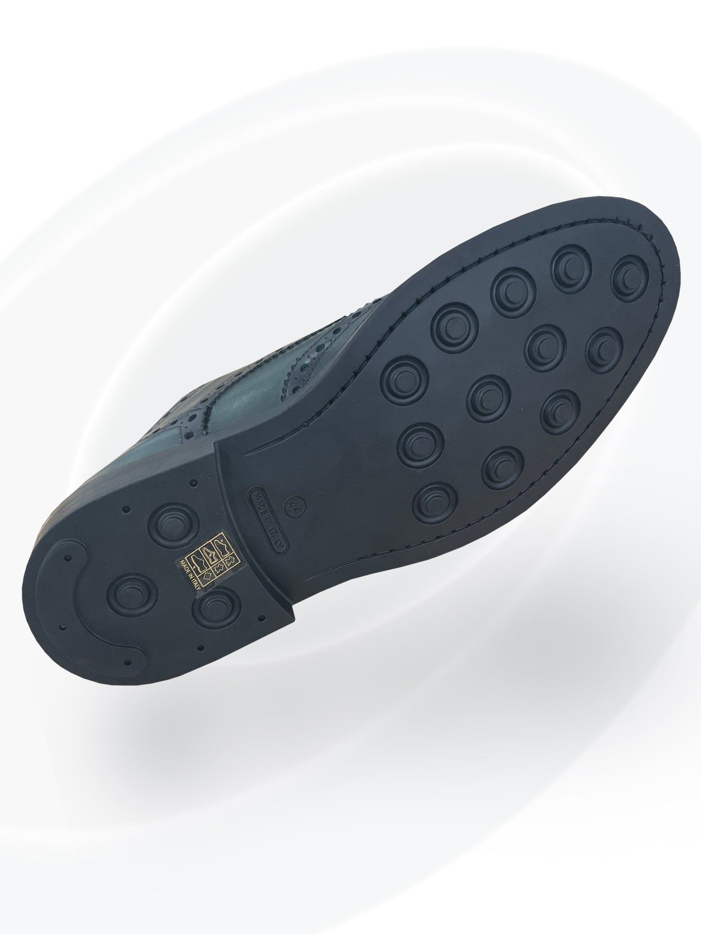 Close-up of a shoe sole with tread pattern on a white background