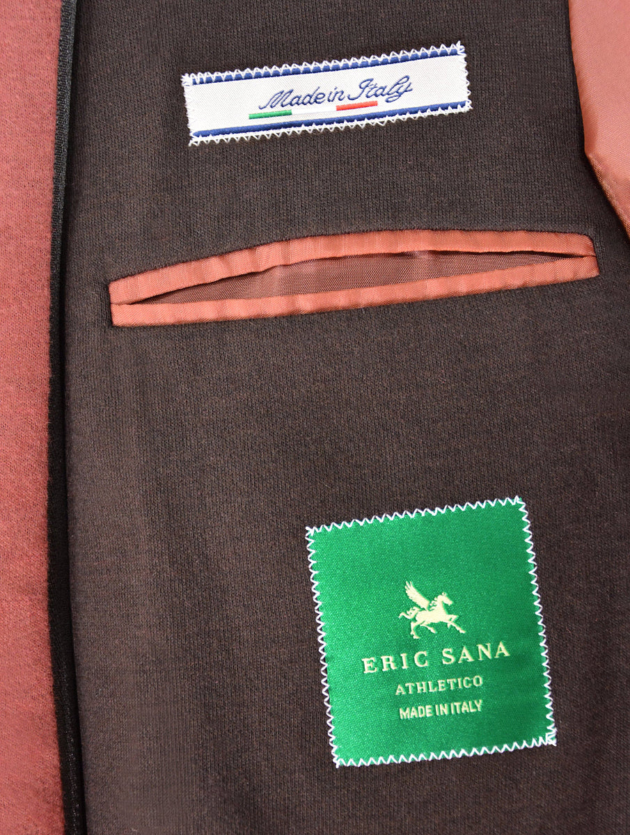 Brown jacket with 'Made in Italy' and 'ERIC SANA' labels on a close-up view.