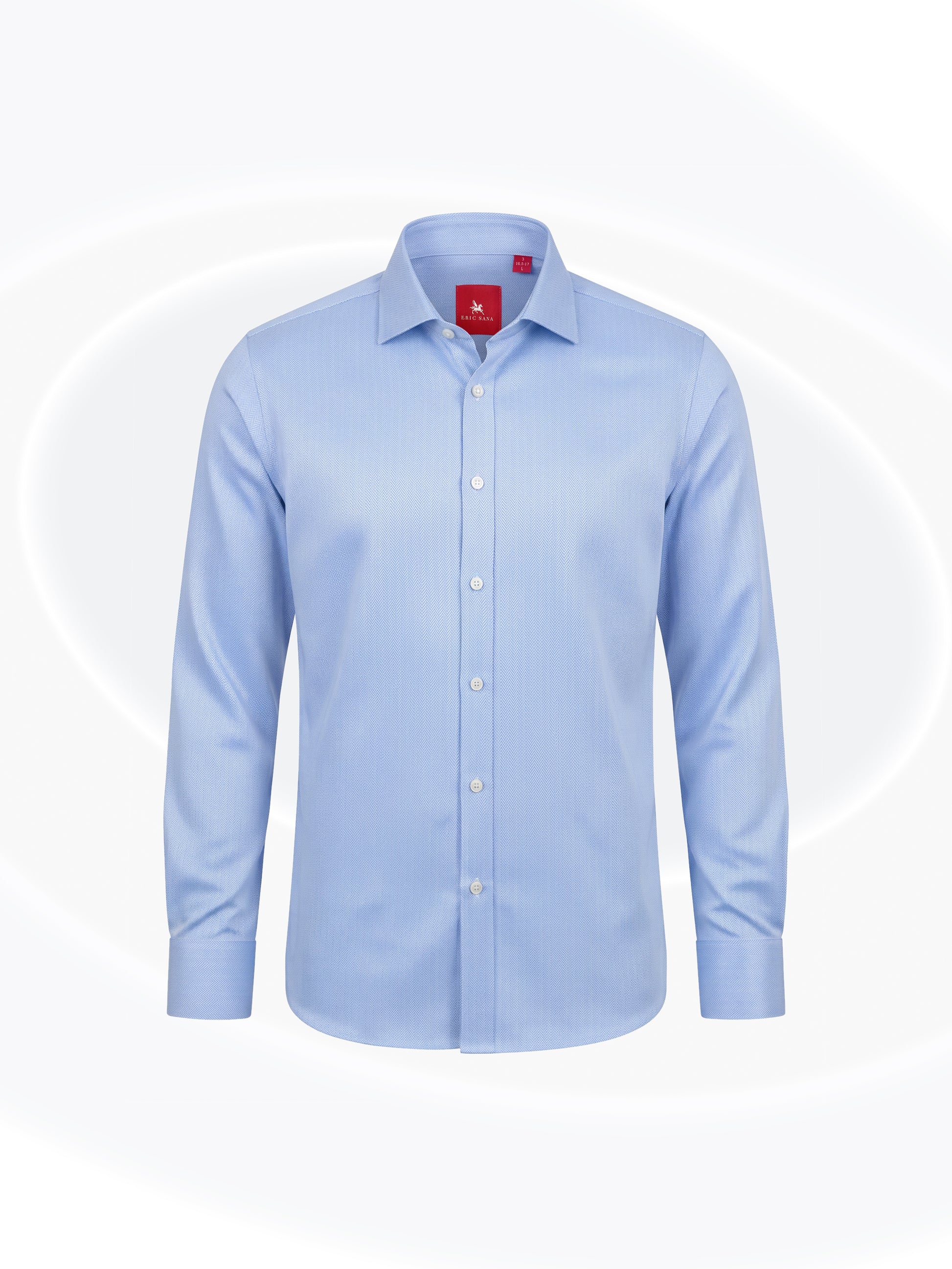Sky blue herringbone long-sleeve button-down Essential Shirt with a classic collar and red Eric Sana label, displayed on a white background.