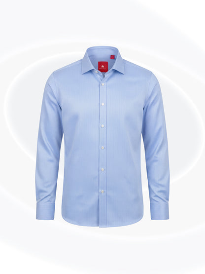 Sky blue herringbone long-sleeve button-down Essential Shirt with a classic collar and red Eric Sana label, displayed on a white background.