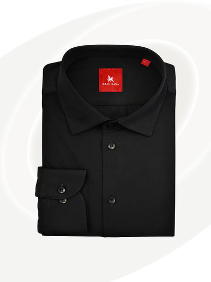 Black long-sleeve dress shirt neatly folded with a red Eric Sana logo label, displayed on a white background — Essential Shirt.