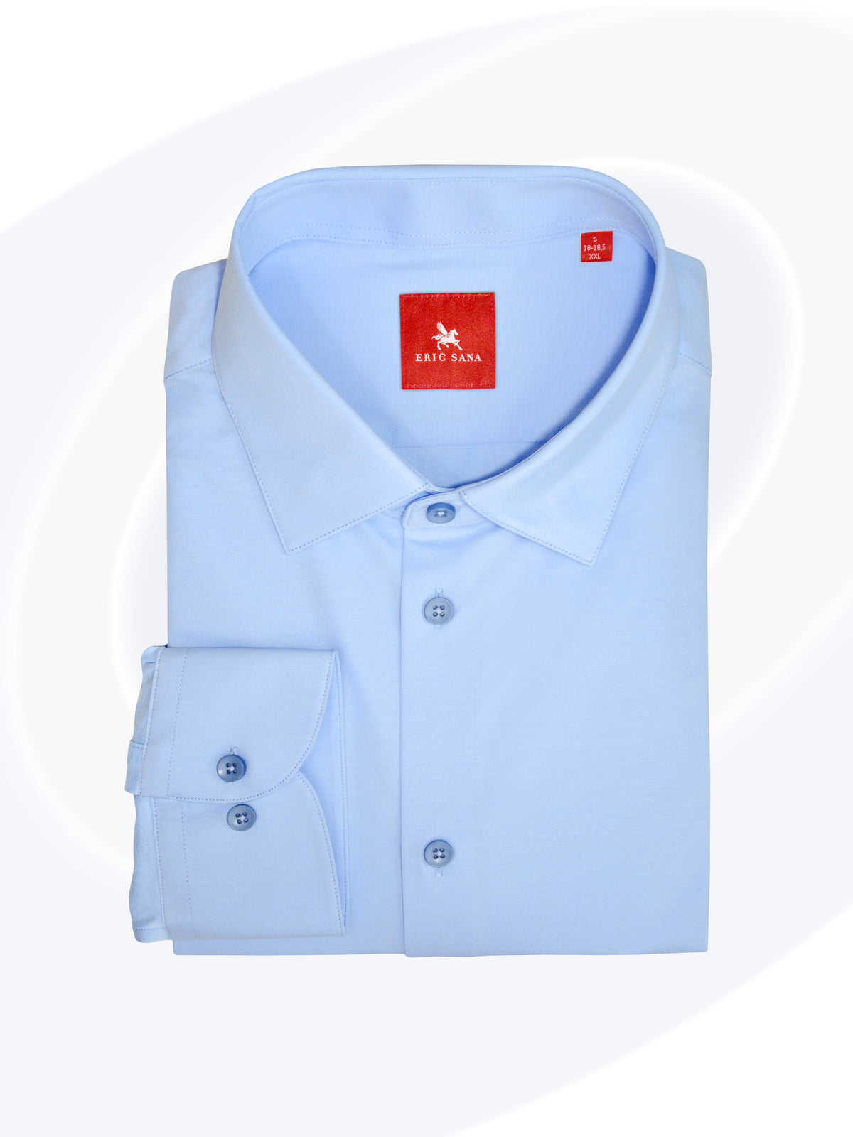 Sky blue long-sleeve dress shirt neatly folded with a red Eric Sana logo label, displayed on a white background — Essential Shirt.