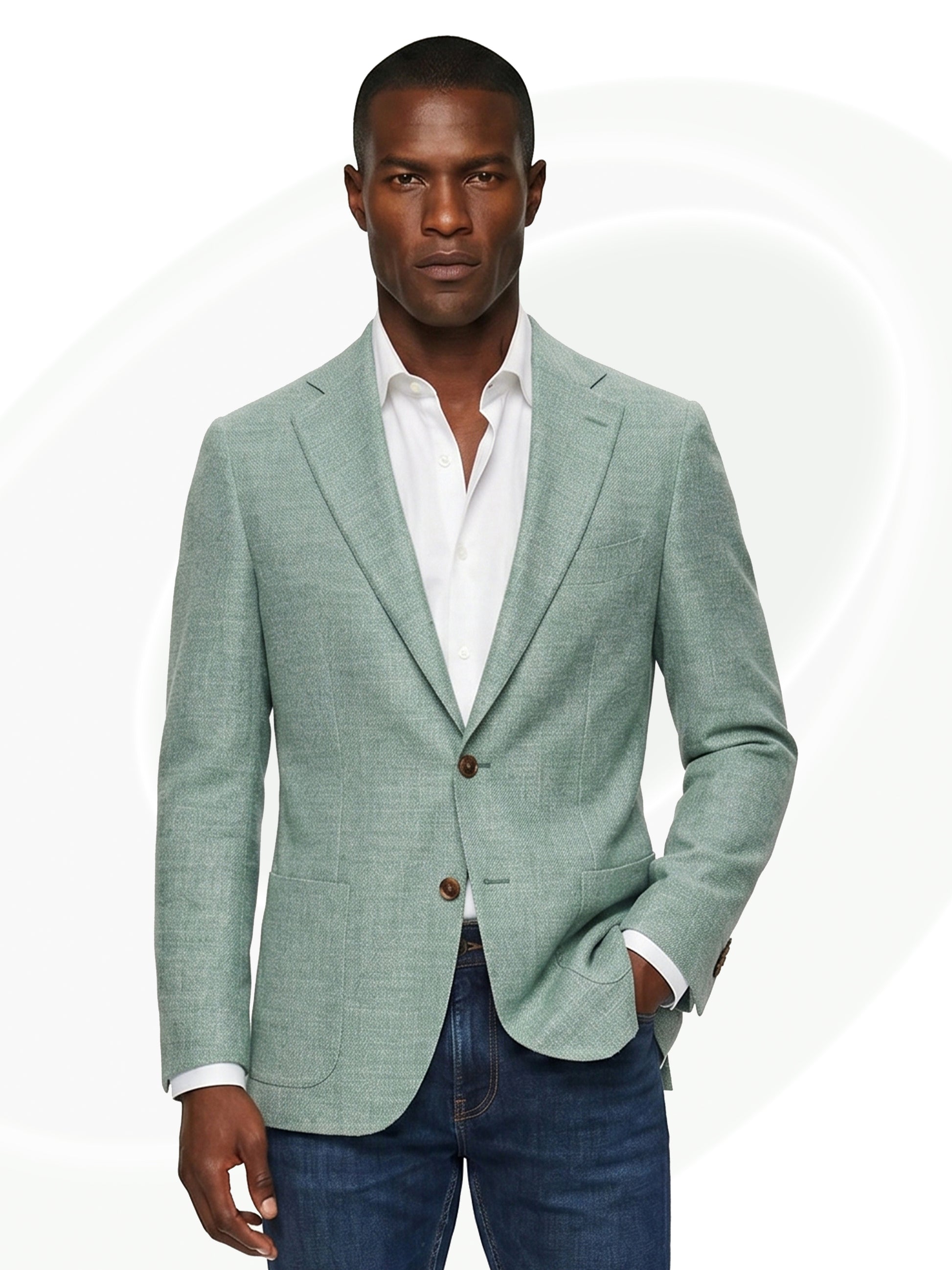 Man wearing green linen blazer over white shirt and dark jeans