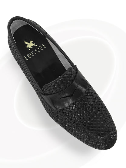 Black woven loafer shoe on a white background