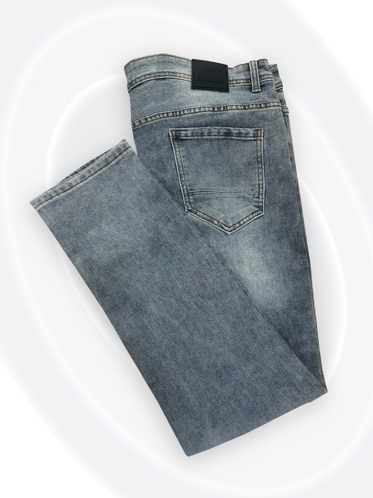 Folded blue jeans on a white background