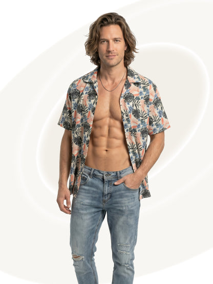 Man wearing a floral shirt and ripped jeans