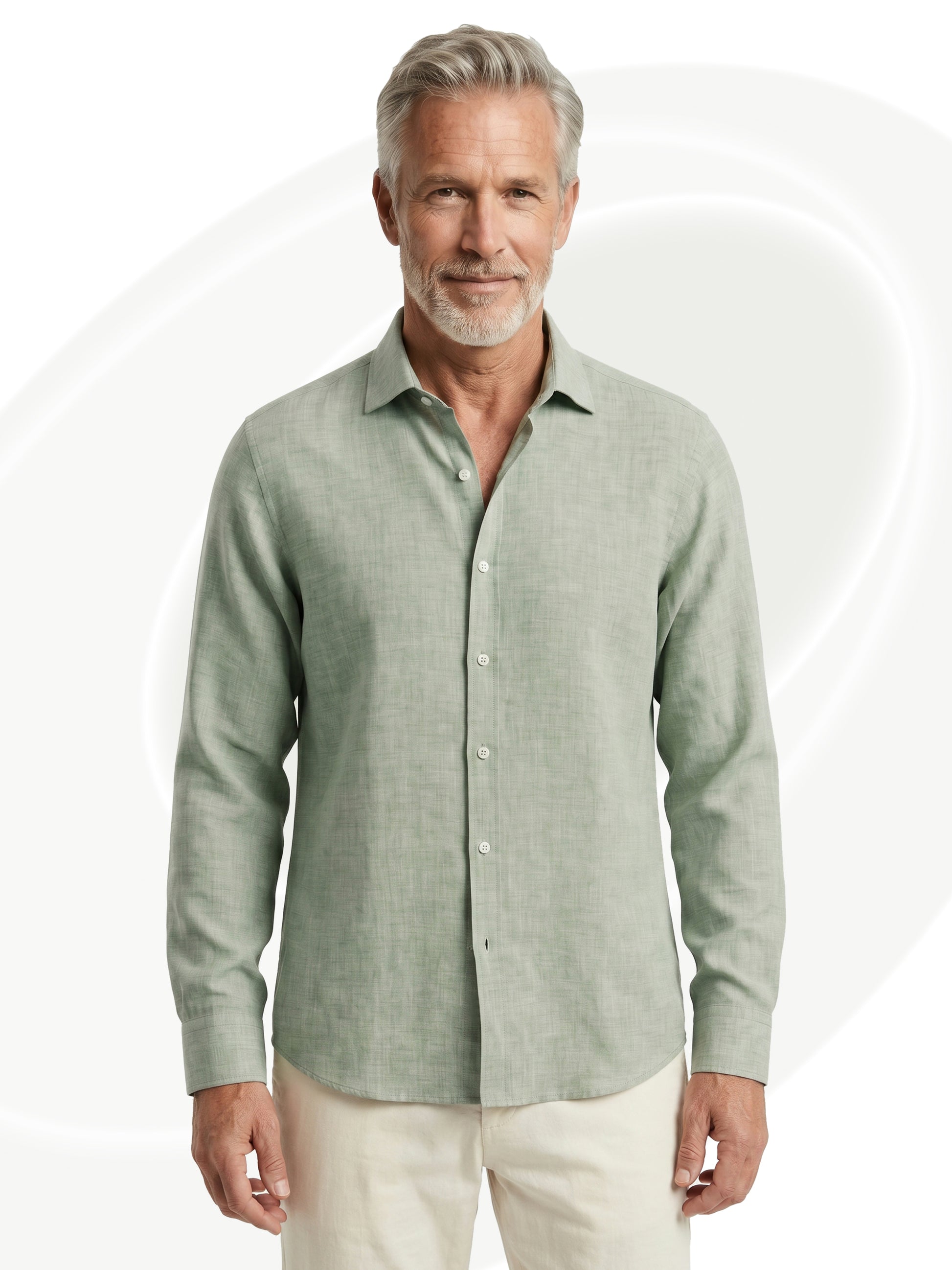 Man wearing a light green linen shirt on a white background