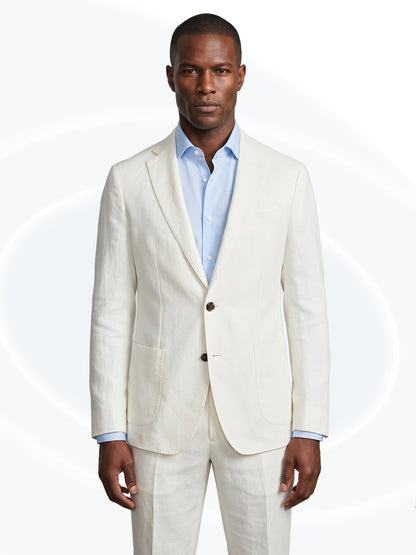 Man wearing a white linen suit with a white background