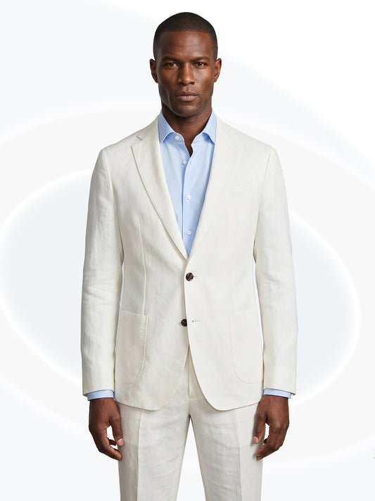 Man wearing a white linen suit with a white background