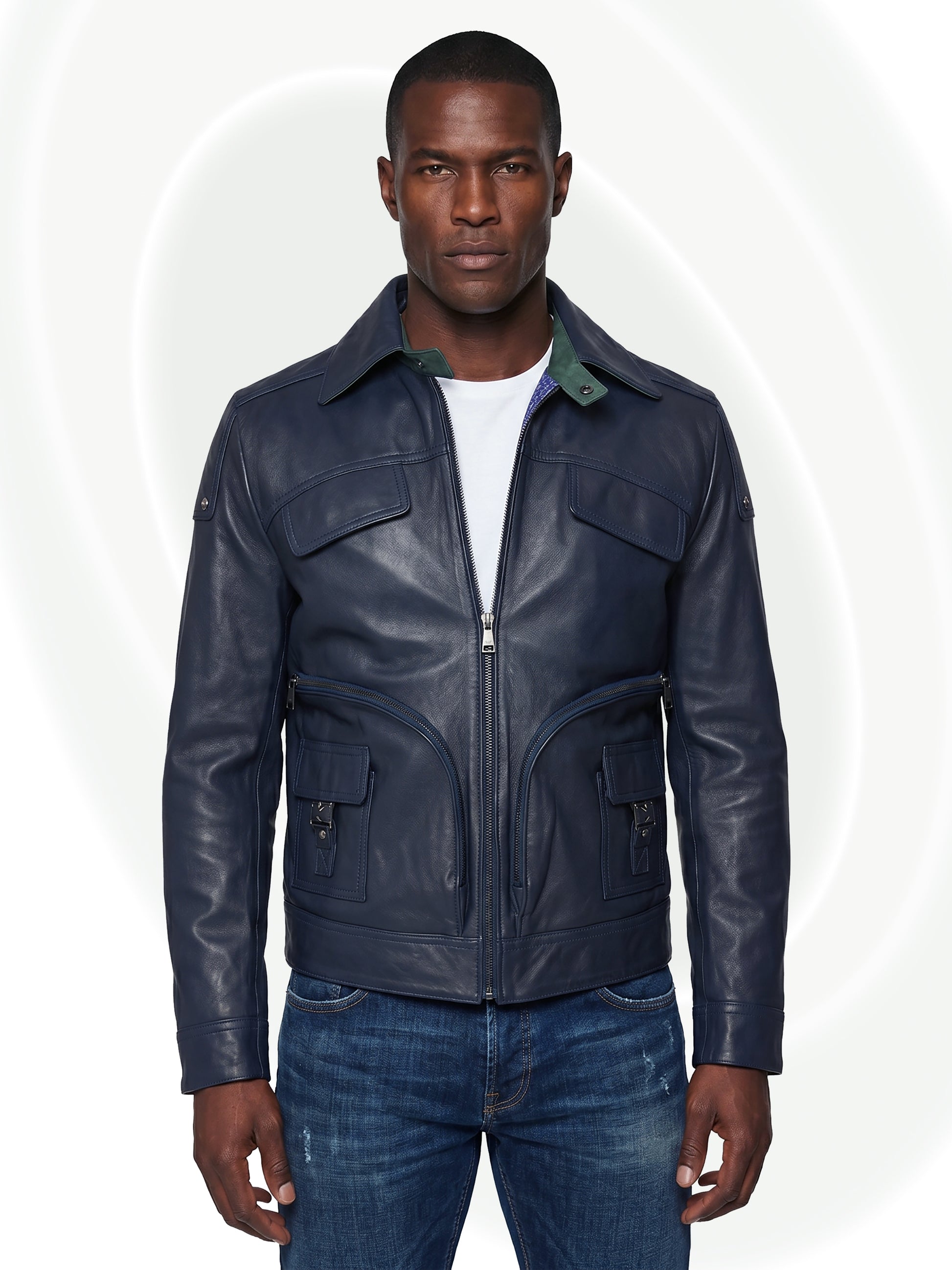 Man wearing a deep blue leather jacket on a white background