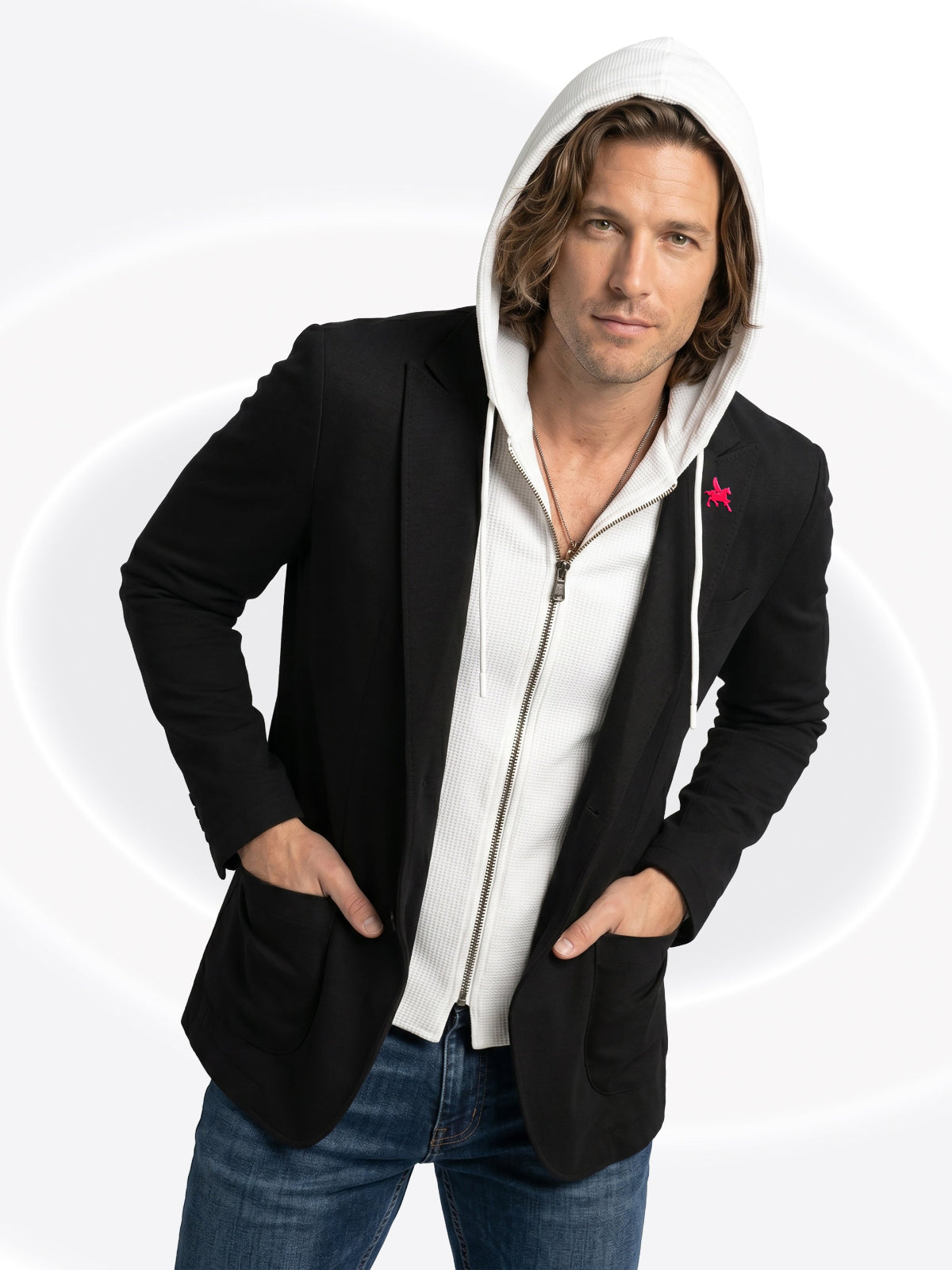 Man wearing a black hoodie over a white shirt with a red star on a white background