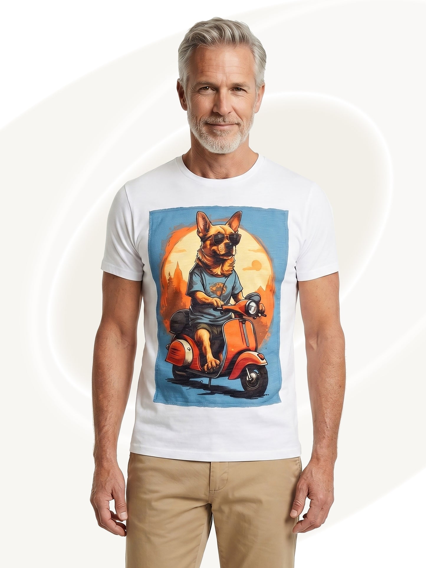 Man wearing a white t-shirt with a graphic of a dog on a scooter, standing against a plain background.
