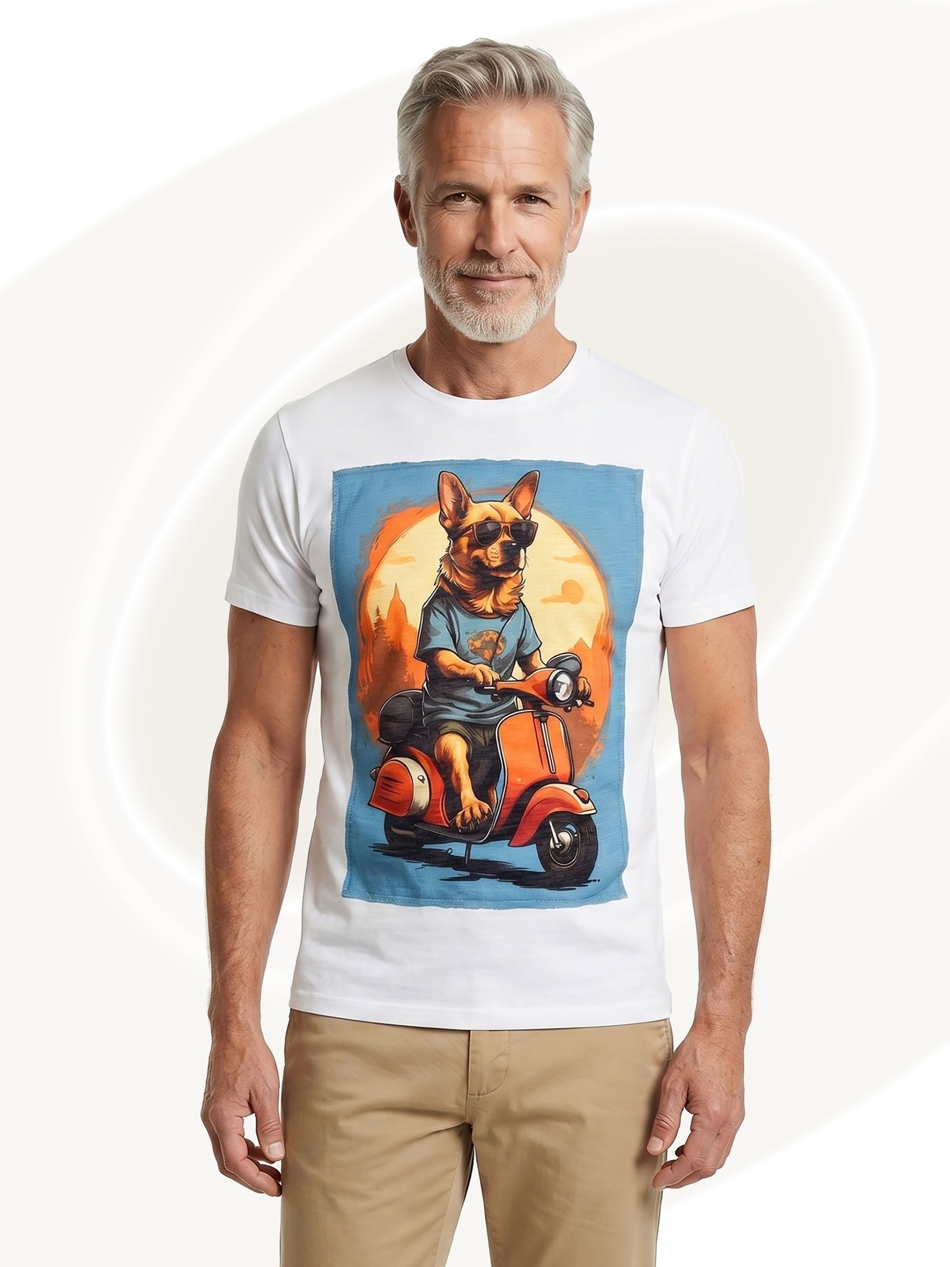 Man wearing a white t-shirt with a graphic of a dog on a scooter, standing against a plain background.