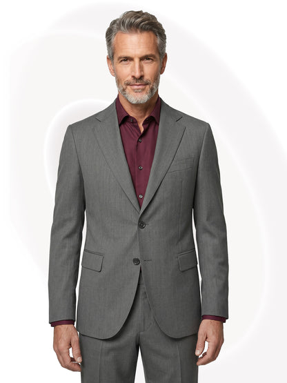 Man wearing a gray suit with a wine red shirt on a white background