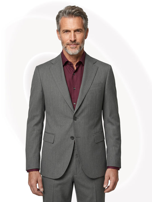 Man wearing a gray suit with a wine red shirt on a white background