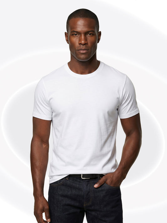 Man wearing a plain white t-shirt and dark jeans on a white background